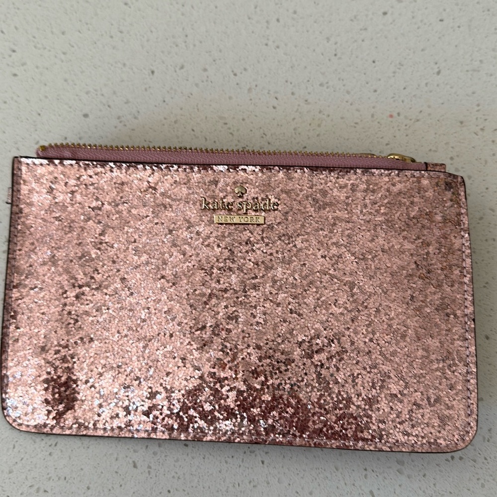 New, never used Kate Spade pink sparkles wristlet.